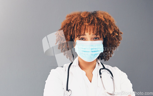 Image of Portrait, mockup and healthcare with black woman, mask and safety regulations against grey studio background. Face cover, Jamaican female doctor and medical professional with stethoscope and trust