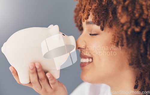 Image of Smile, piggy bank or happy black woman with savings budget or financial profits growth on studio background. Face, finance or African girl holding tin container for cash loan or money investment