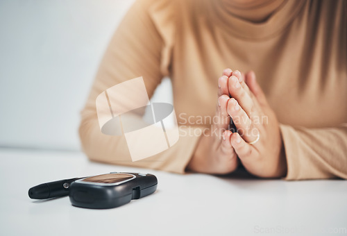 Image of Diabetes, praying and equipment with hands of woman for medical, illness and blood test. Healthcare, medicine and technology with patient and machine for insulin exam, glucometer and monitor