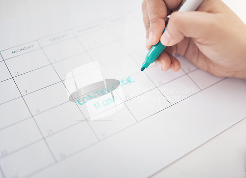 Image of Hands, writing and calendar planning contractor commitment or appointment for organized reminder. Hand of person with blue marker to write time or project management on construction schedule planner