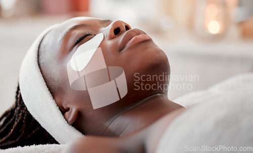 Image of Beauty, relax and eye mask with black woman in spa for skincare, facial treatment and wellness. Health, peace and luxury with girl and face patches product for cosmetics, dermatology and hospitality