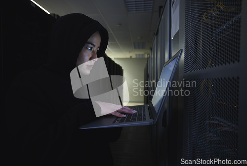 Image of Hacker, server room and woman computer coding, data center crime and ransomware of cyberpunk in dark. Laptop hacking, person or thief in cybersecurity, information technology and criminal programmer