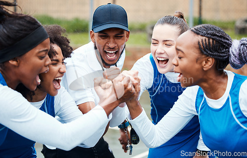 Image of Fist, motivation or team support in netball training game screaming with hope or faith on sports court. Teamwork, fitness coach or group of excited athlete girls with pride or solidarity together