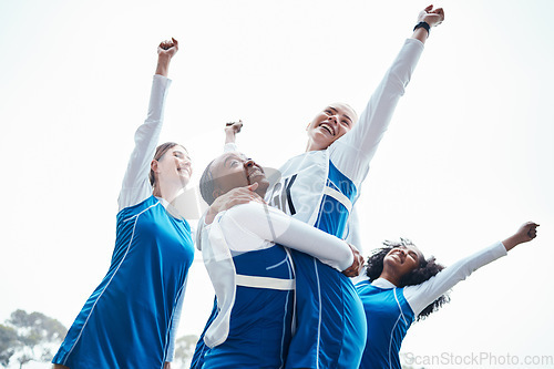 Image of Women, friends and celebration for winning, sports team or success raising fist together in the outdoors. Happy sporty woman group smiling in sport teamwork celebrating win, victory or achievement