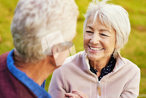 Image of Old couple, relax in the park and smile, happiness together with bonding in nature, face with love and retirement. Happy, man and woman with travel, relationship with trust in marriage and commitment