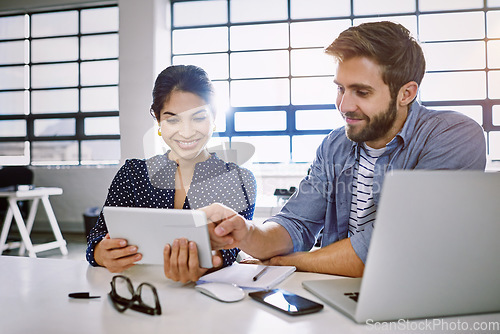 Image of Internet, tablet and woman with man in office sharing idea or meme at meeting for creative project. Teamwork, social media and employees in startup discussion at design agency for content marketing.