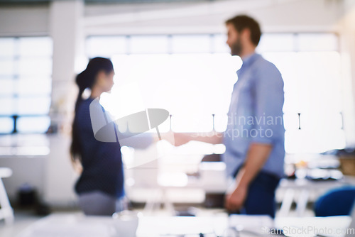 Image of Team hand shake, office collaboration or people at investment deal, b2b contract negotiation or acquisition agreement. Human resources blur, hiring welcome or onboarding job interview with HR manager