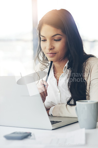 Image of Business woman, laptop and thinking in workplace with vision, internet research and strategy for goals. Young executive, computer and brainstorming for ideas, focus and website management in office