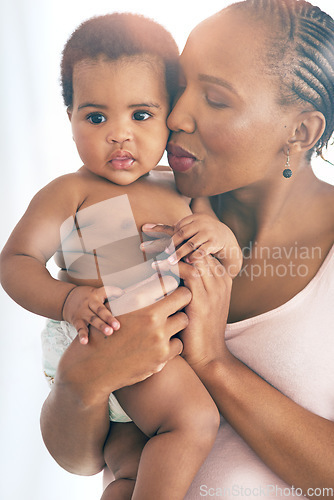 Image of Black woman with baby, love and hug with family, content and bonding with face and early childhood and happiness. African female, mother holding child with parenting, motherhood and cuddle with care