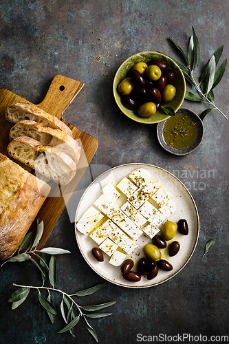 Image of Feta cheese, olives and ciabatta, top view