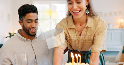 Image of Birthday, cake and couple kiss with celebration, surprise and gift from wife to her husband with love in home. Man and woman celebrating, party and happy together with a present, snack or dessert