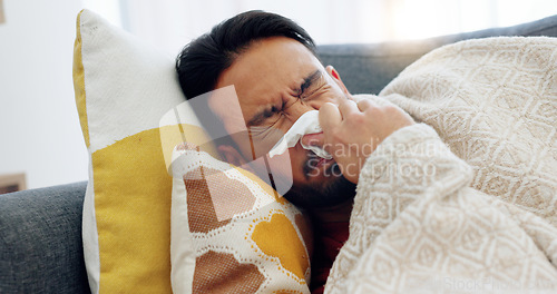 Image of Sick, tired and sad man lying on sofa at home feeling ill, unhappy or depressed thinking about problems, grief or sorrow. Anxiety, depression and mental health of asian male crying over heartbreak