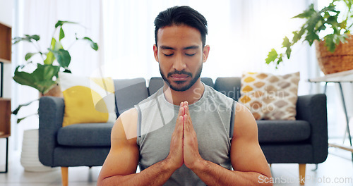 Image of Meditation exercise, man yoga training and zen workout for spiritual health, relax for wellness and prayer hands for health in living room. Calm, healthy and Asian person praying for motivation