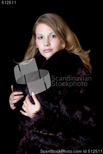 Image of The young beautiful woman in a fur coat