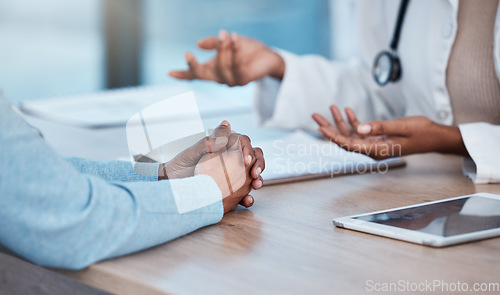 Image of Doctor, patient and hands in healthcare consultation, diagnosis or medical help on office desk by hospital. Hand of nurse talking, consulting or breaking news to customer for life insurance or advice