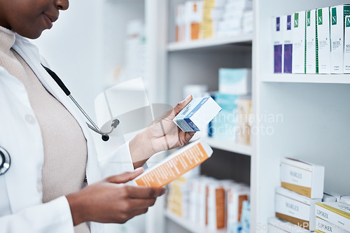 Image of Black woman, pharmacy and choice with box, medicine and decision with prescription for healthcare. Pharmacist, drugs and pharmaceutical pills for health, wellness or medical store with stock on shelf