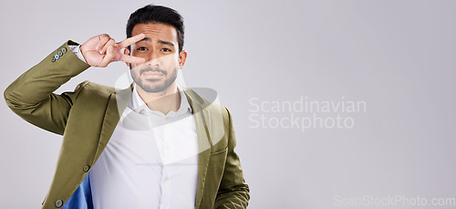 Image of Portrait, peace and mockup with a business man in studio on a gray background for branding or advertising. Marketing, mock up and hand sign with a male employee indoor to promote product placement