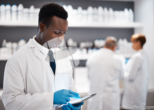 Image of Science, black man and tablet with research, chemist and connection for typing, laboratory and focus. African American male employee, researcher and scientist with device, future or telehealth in lab