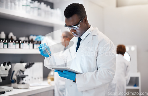 Image of Science, research and black man in laboratory with tablet for medical analysis and digital innovation in medicine. Pharmaceutical analytics, web and scientist in South Africa checking results online.