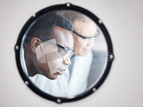 Image of Science, research and black man in laboratory incubator window for experiment, study and medical test. Healthcare mockup, biotechnology and male scientists with concentration for sample storage