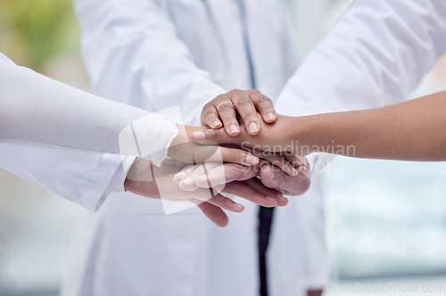 Image of Doctors, nurses or hands stack in hospital motivation, team building or medical mission for goals, community or support. Zoom, women or healthcare diversity in teamwork circle or collaboration huddle