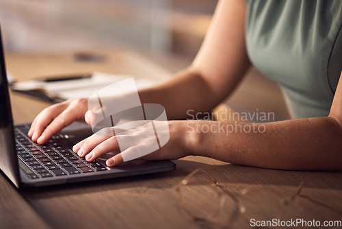 Image of Business woman, hands or laptop typing in night office for company budget, investment management or finance data analytics. Zoom, worker or late employee on technology keyboard for financial report