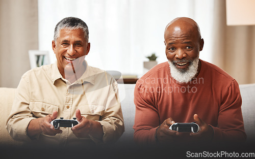 Image of Gamer, fun and senior black man friends playing a video game together in the living room of a home. Sofa, funny or retirement with a mature male and friend gaming or bonding during a visit in a house