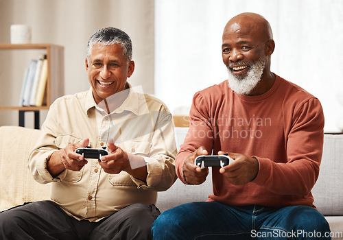 Image of Gaming, funny and senior black man friends playing a video game together in the living room of a home. Sofa, fun or retirement with a mature male gamer and friend enjoying a house visit to game