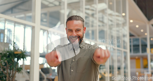 Image of Business man, thumbs up and success portrait while walking in office for support, yes or thank you. Happy person excited about winning, goals or target at creative workplace with hands for like emoji