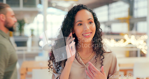 Image of Phone call, face and happy with a business black woman in her office, talking on her mobile. Communication, networking and smile with a young female employee chatting on her smatphone at work