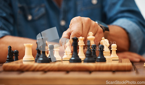 Image of Chess, play and hands with a knight on a board game with a strategy in home competition. Checkmate, chessboard and smart man or male playing in a sports contest or problem solving challenge for mind.