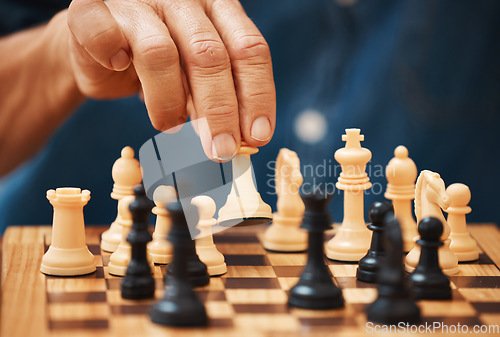 Image of Chess, play and hands with a queen on a board game with a strategy in home competition. Checkmate, chessboard and smart man or male playing in a sports contest or problem solving challenge for mind.