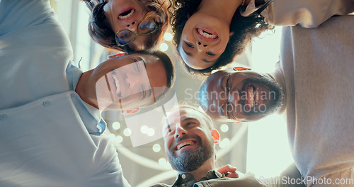 Image of Teamwork, collaboration and huddle of business people in office or workplace with low angle. Team building, solidarity and group of employees hug for unity, union and motivation, goals and targets.