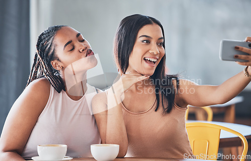 Image of Women friends, coffee shop and smartphone for selfie, happy or solidarity with beauty on social network. Gen z black woman, phone and relax in cafe for blog, profile picture or photography on web app