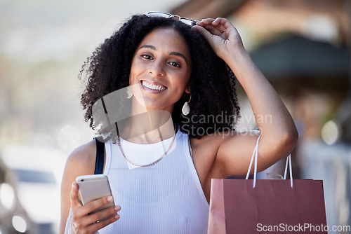 Image of Black woman, portrait or phone in city with shopping bags, gift or store parcel and social media, sales promo or discount deals. Smile, happy or retail customer on mobile technology for urban fashion