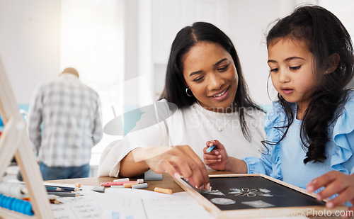 Image of Education, homeschool and woman with child drawing in , teaching and learning maths and help with homework. Home school kid, mom and kindergarten girl coloring and writing with chalk for development.