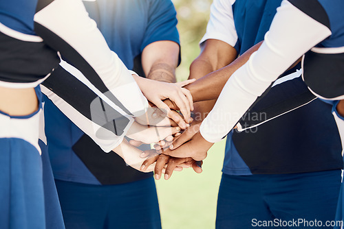 Image of Hands, teamwork and motivation with cheerleaders in a huddle for support during a sports game or competition. Training, event and a group of cheerleading women in a circle for a performance