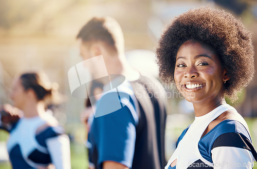 Image of Happy, sports and portrait of a black woman at cheerleading, rehearsal and team practice. Smile, cheerful and African cheerleader at a sport event, competition or performance with a squad on a field