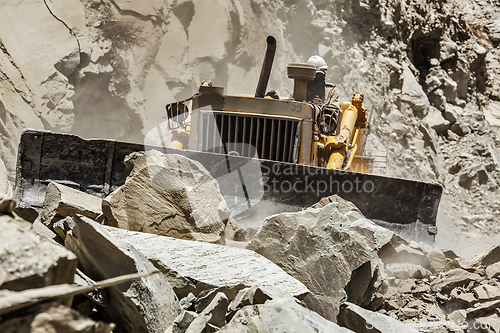 Image of Bulldozer doing road construction in Himalayas