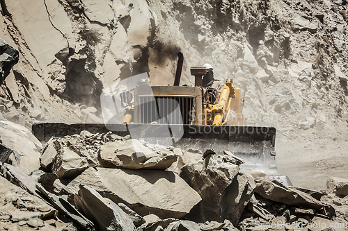 Image of Bulldozer doing road construction in Himalayas