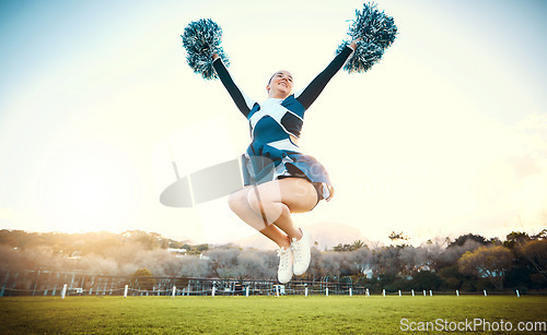 Image of Sports woman, sky and cheerleader jump with energy to celebrate goal outdoor. Cheerleading or athlete person dance in nature with pompoms for performance, game or competition on a green grass field