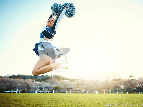 Image of Cheerleader, woman jump to sky for sports performance or celebration with energy outdoor. Cheerleading person dance in nature with space for training, exercise and sport competition to celebrate goal