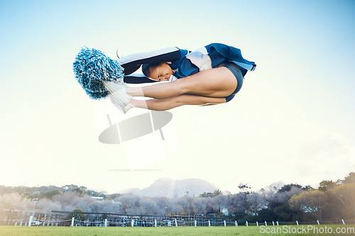 Image of Cheerleader woman, jump and sports outdoor on blue sky for performance, energy and celebration. Cheerleading person dance or stunt for training workout, freedom or competition to support game