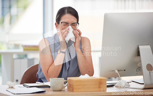 Image of Sick, computer and blowing nose with woman in office for virus, illness and allergy symptoms. Sneezing, disease and tissue with employee suffering with infection at desk for flu, fever and cold