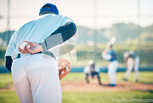 Image of Man, baseball and pitcher ready to throw ball for game, match or victory shot on grass field at pitch. Male sports player with hand behind back with mitt in preparation for sport pitching outdoors