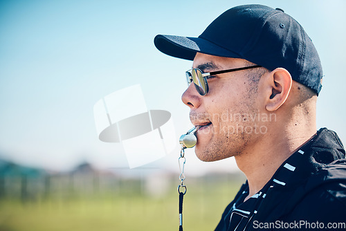Image of Coach, blowing whistle and sports training on a field with a man outdoor for competition or challenge. Fitness trainer or teacher person face profile for athlete game, coaching and pitch strategy