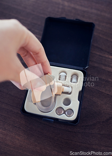 Image of Disability, hearing aid and healthcare with hands of woman for ear implant, medical and technology. Medicine, audiology and listening devices for deaf with patient for sound, communication and help