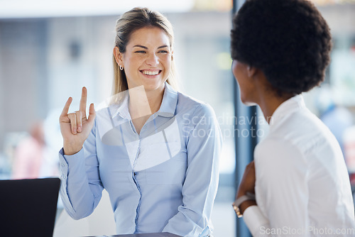 Image of Collaboration, meeting and hand gesture with business women in the office, working on a project together. Teamwork, planning or shaka sign with a happy female employee and colleague talking at work