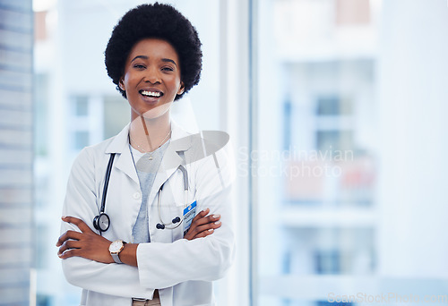 Image of Medical, smile and happy with portrait of doctor for for healthcare, expert and professional. Medicine, wellness and surgeon with black woman and arms crossed for proud, confidence or life insurance