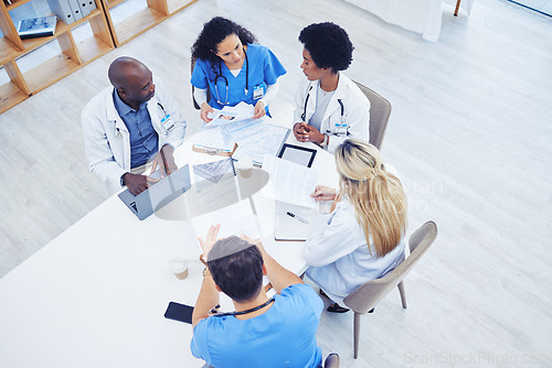 Image of Above, healthcare and meeting by doctors on laptop for research, planning and innovation at hospital. Doctor, team and health experts brainstorm, problem solving or discussing online project together